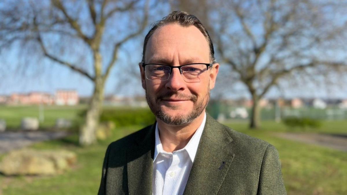 A man wearing glasses