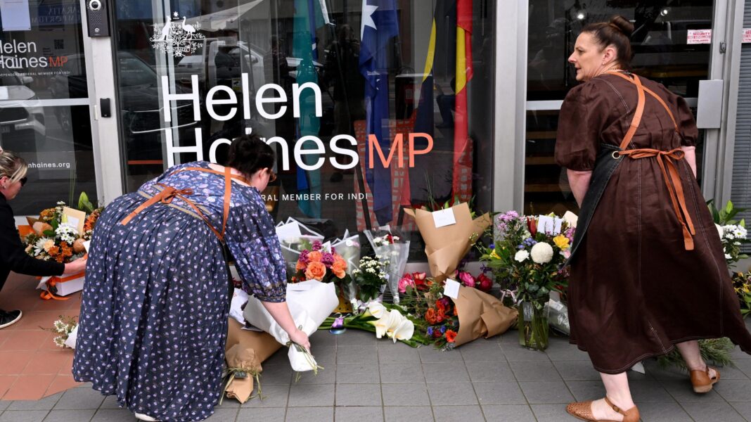 Man charged with attack on Australian MP as suspect’s father says she is family friend Women leaving flowers outside Helen Haines's office