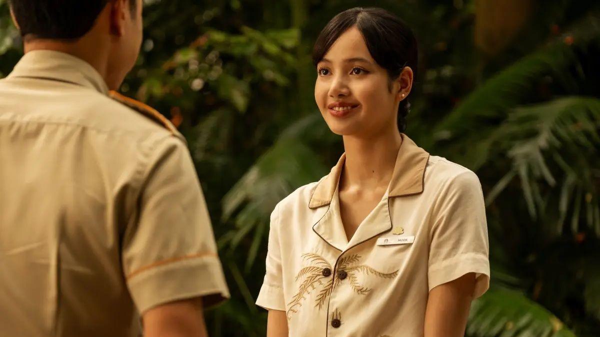 Lisa in character as hotel worker Mook Sornsin in The White Lotus