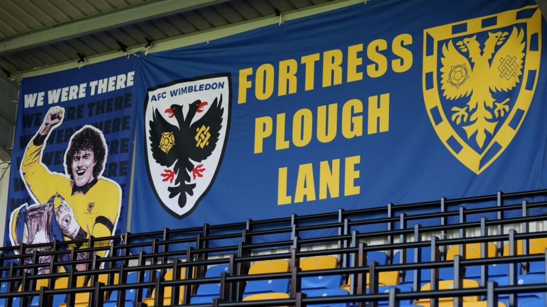 Ex-England defender Bertrand eyes £87m AFC Wimbledon deal Picture of banners inside Plough Lane, AFC Wimbledon's ground