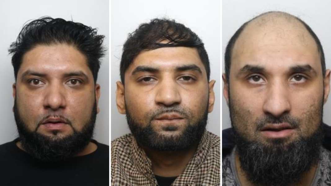 A composite of three mugshots placed side by side. Amar Ilyas on the left is shown from the shoulders upward, facing directly toward the camera. He has dark hair styled upward and slightly back, along with a full beard and moustache. He is wearing a dark top, and the face is evenly lit, with no strong shadows. In the centre portrait, Kamran Ilyas is presented in a similar head-and-shoulders format, also facing forward. He has short, dark hair and a full beard and moustache. The clothing appears to be a brown or patterned garment or shirt. In the right portrait, Kamar Ilyas is shown with very little or no hair on the head and a full beard. He is wearing a dark or muted jacket or top.