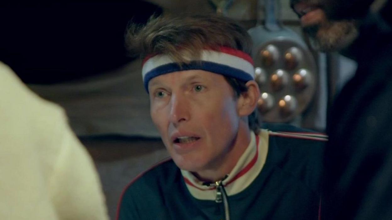 James Blunt wearing a sweatband