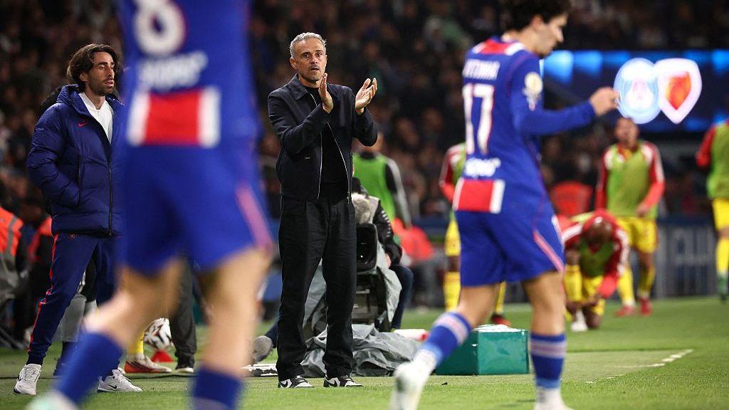 Luis Enrique gestures to his players during the match against Le Mans