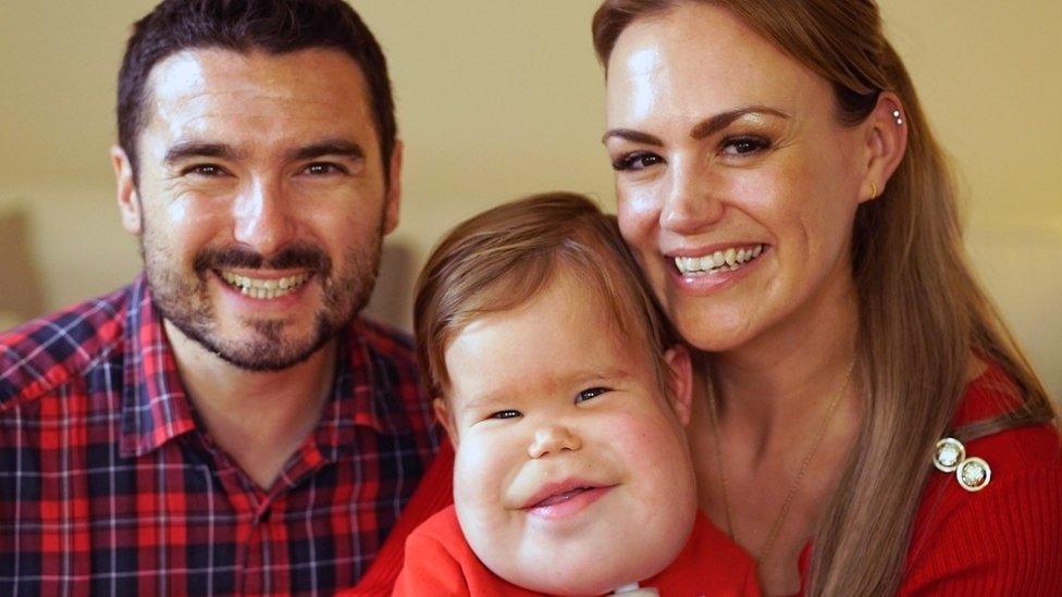 Finley with his mum and dad
