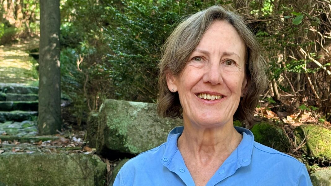 ‘I live with a ghost’: Japan’s haunted homes attract bargain hunters Diane Tincher smiles at the camera. She is wearing a blue shirt and standing in her garden