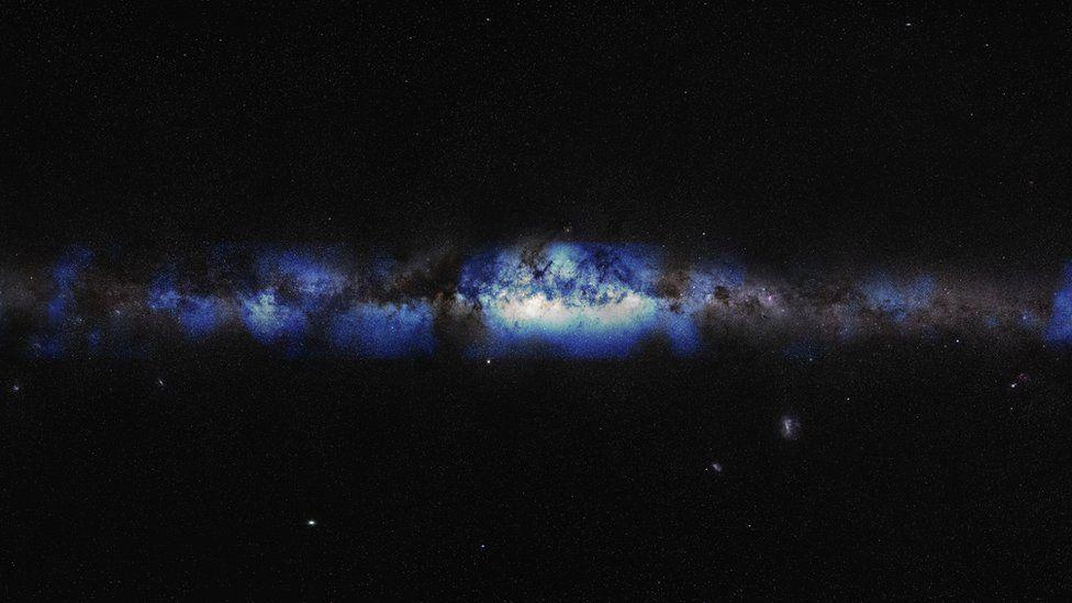 A starry black sky with the Milky Way in blue running through the centre