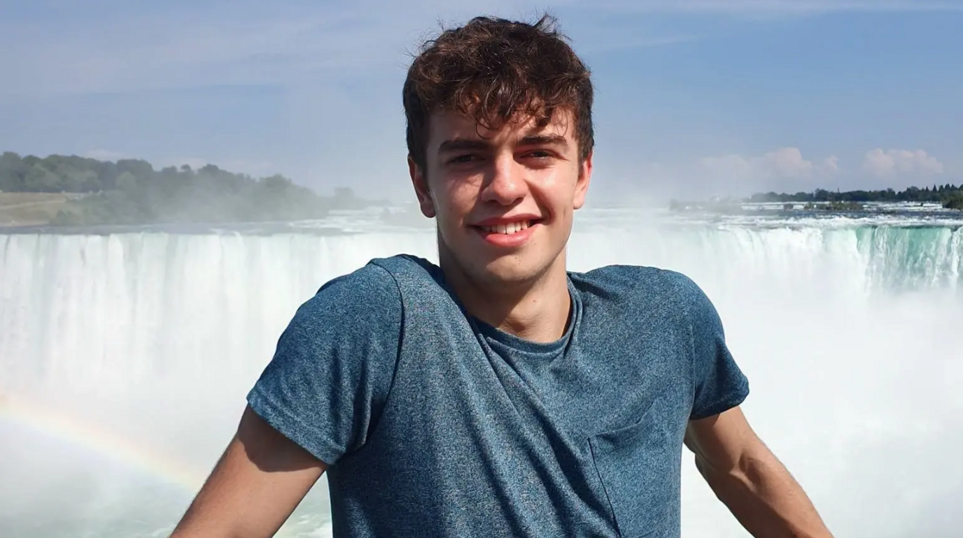 William Chapman by a waterfall