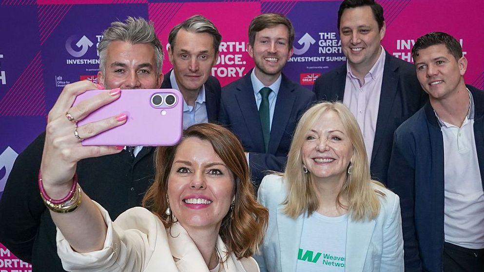 Kim McGuinness, North East Mayor, and Chair of The Great North takes a selfie featuring (L-R) David Skaith, York and North Yorkshire Mayor, Paul Thwaite, CEO of Natwest Group, Dan Tomlinson MP, Exchequer Secretary to the Treasury, Tracy Brabin, West Yorkshire Mayor, Ben Houchen, Tees Valley Mayor and Luke Campbell, Hull & East Yorkshire Mayor, during The Great North Investment Summit at the Royal Armouries Museum on May 11, 2026 in Leeds, England.