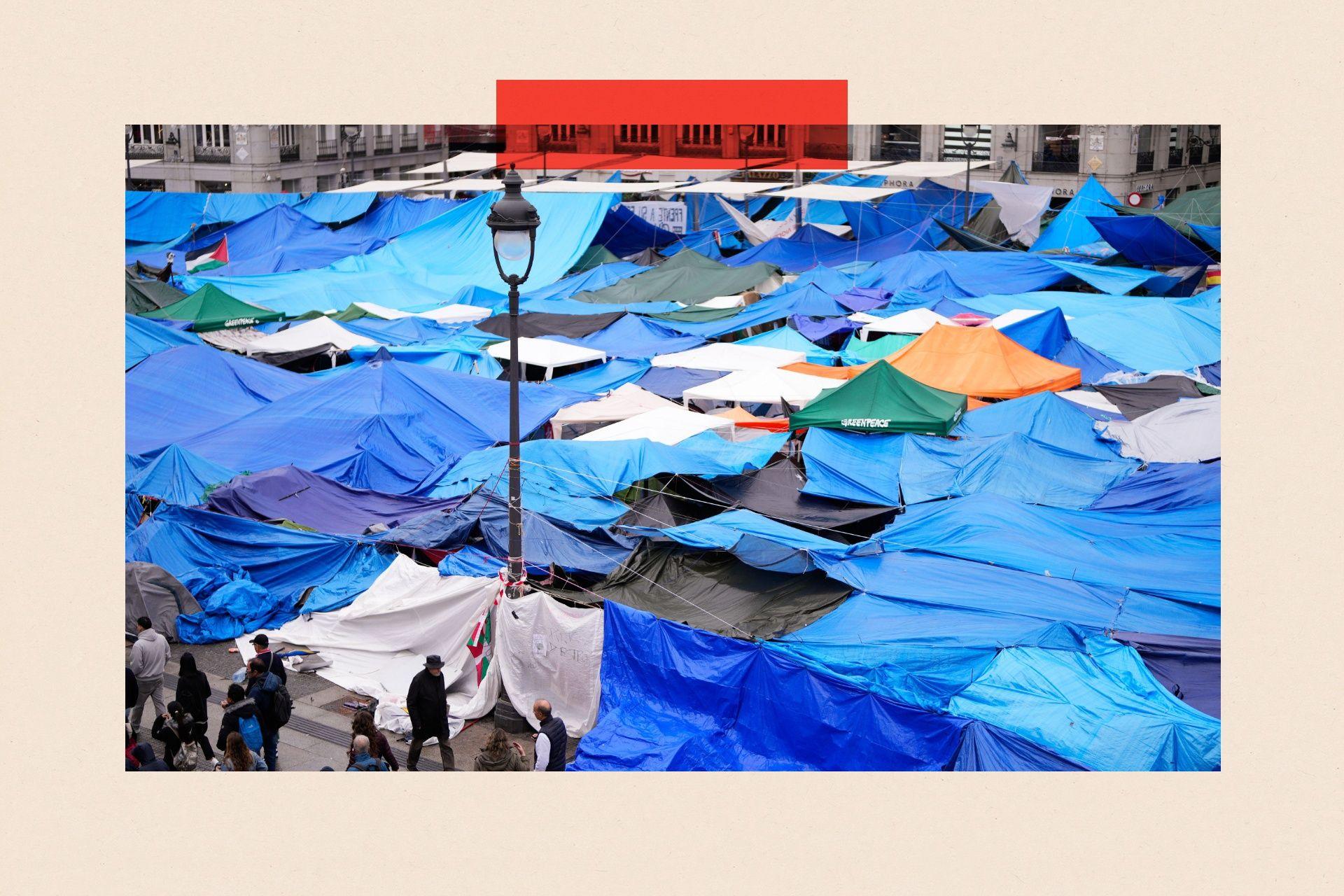 People walk past tents of a housing protest encampment at Puerta del Sol square in Madrid, Spain, 18 October 2026. Protesters are in their twenty-first consecutive day and plan to continue the demonstration and expand it to other neighbourhoods.