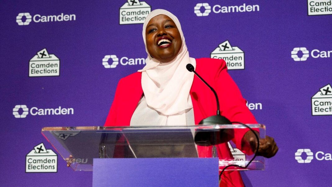 Labour sees off Green challenge to win Holborn by-election Labour's Sagal Abdi-Wali smiles as stands behind a podium in front of a purple backdrop reading "Camden elects", following her by-election win.