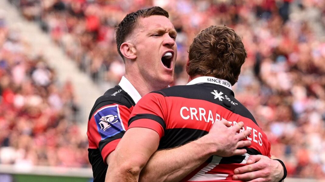 Dallas McLeod hugs a Canterbury team-mate in celebration