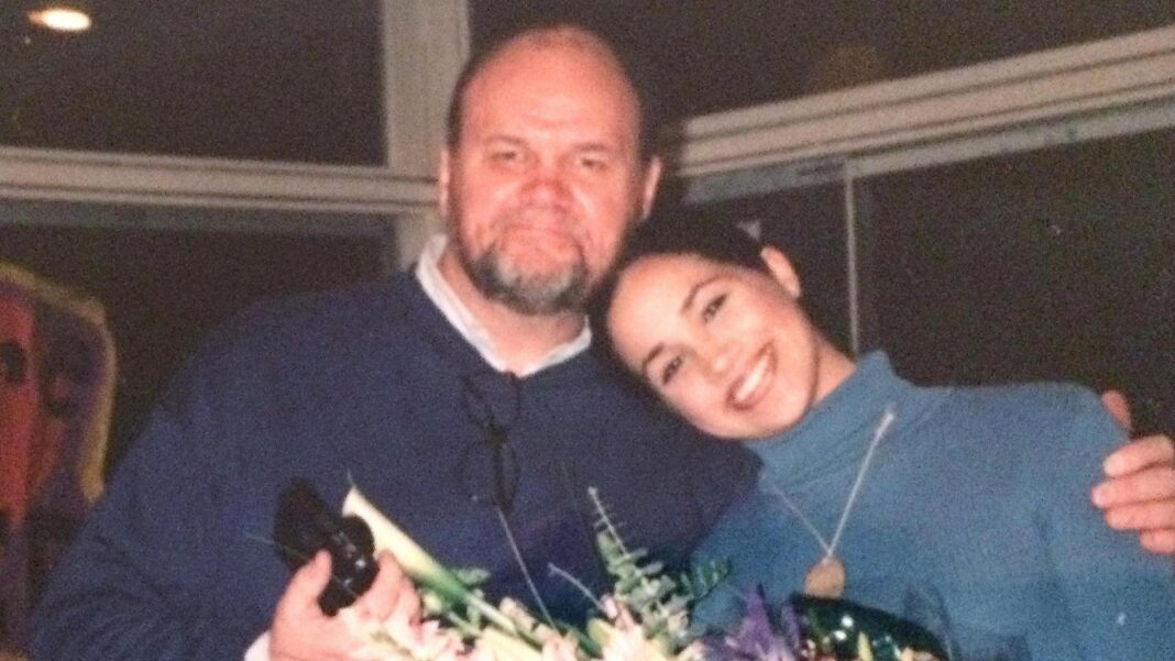 Meghan says she was informed about ‘disturbing allegations’ against her father in 2018 Thomas Markle wears a blue jumper with an arm around Meghan Markle who wears a lighter blue jumper. Both are smiling