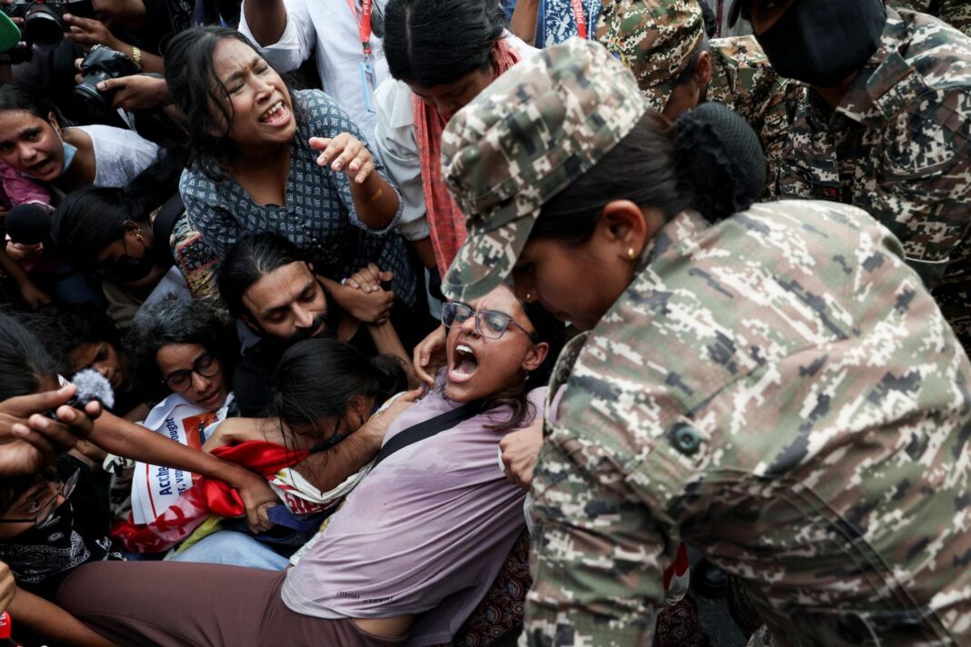Indian opposition leaders to march to top court to demand election chief resign Protesters react as they are detained by security personnel during a protest seeking the resignation of India's Chief Election Commissioner Gyanesh Kumar, in New Delhi, India, October 11, 2026.