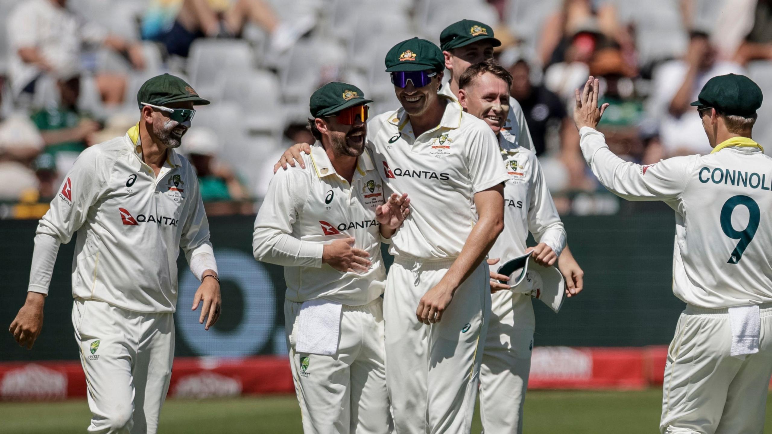 Australia's players celebrate the wicket of Aiden Markram