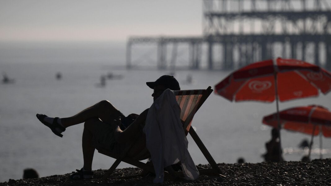 UK on track for one of the warmest years on record after warm September Man sits in deckchair on Brighton beach during early September heatwave