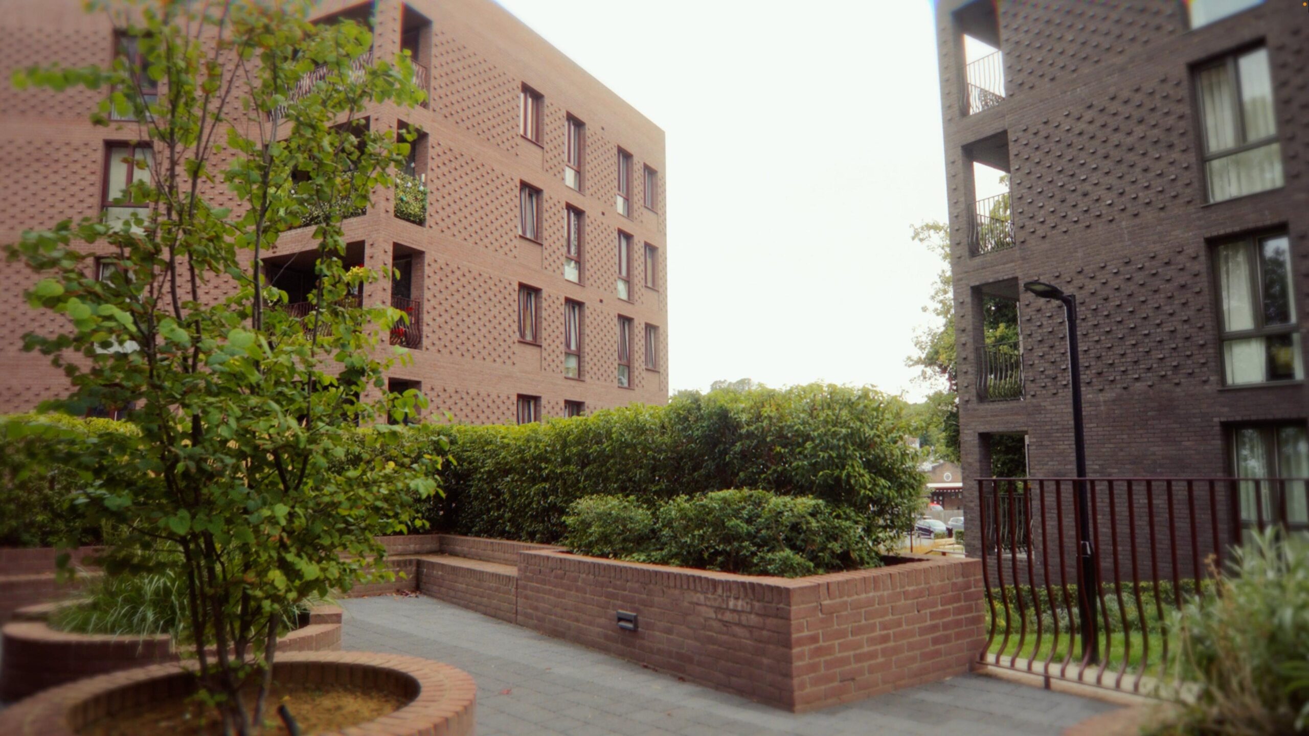 Low rise flats built with purple and pink brinks