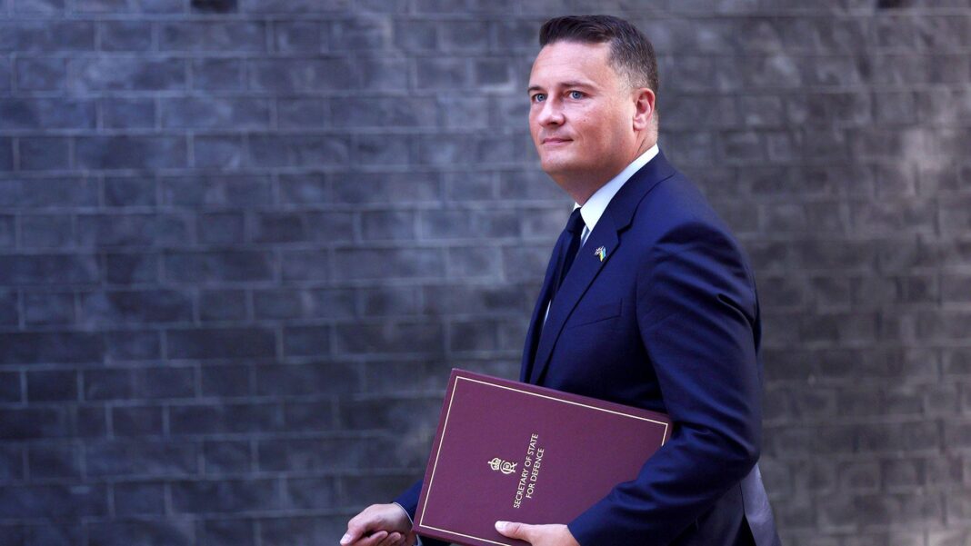 Prepare for supply chain disruption from cyber or climate emergencies, Streeting warns public Wes Streeting walks in front of the Downing Street building facade carrying a binder that says 'Secretary of State for Defence' on the front, in September.