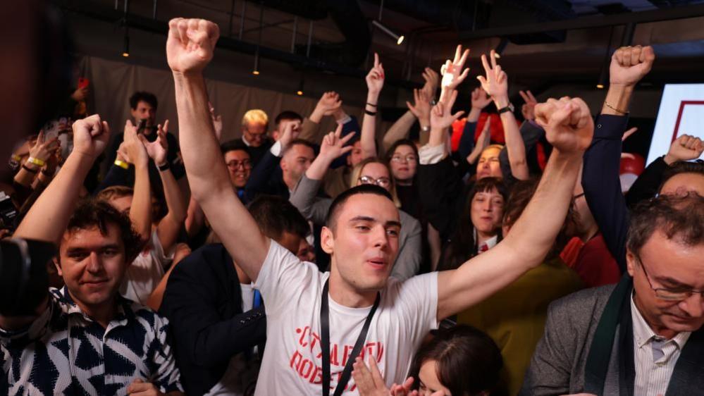 People celebrate at the Student List headquarters in Belgrade, Serbia. Photo: 25 October 2026