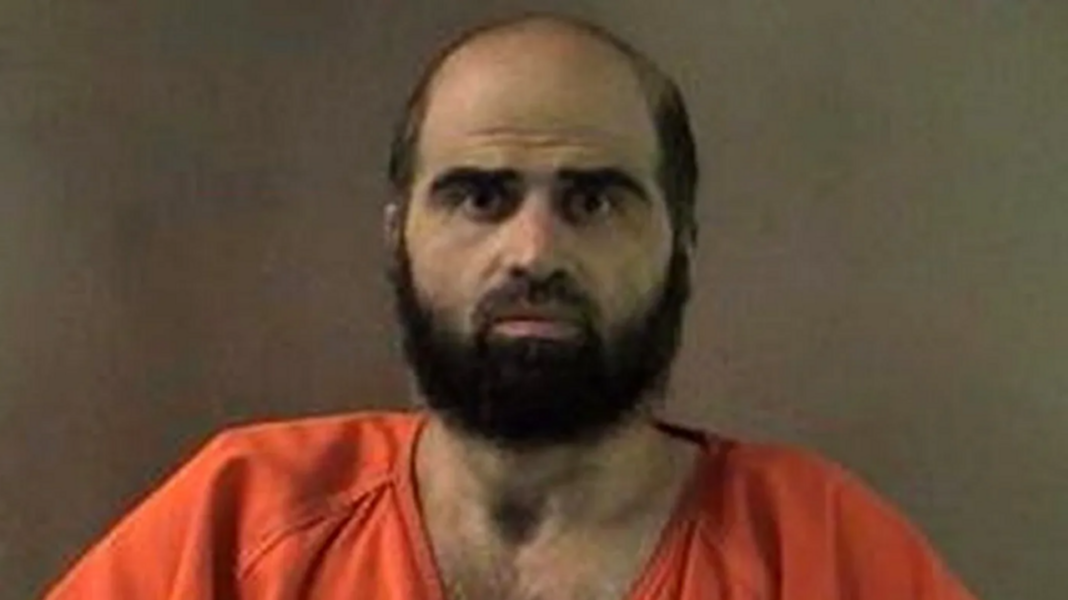 An undated handout image of Hasan that was released by authorities in 2012