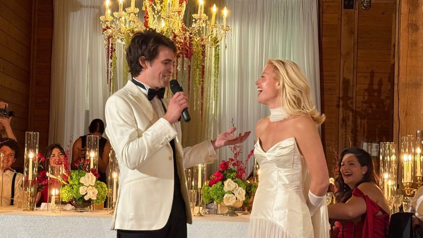Ashe and John Clark Canada in a candid photo from their wedding day in 2025