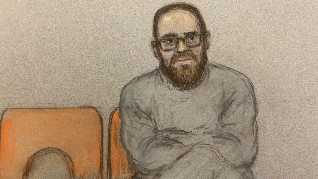 Widdecombe suspect had ‘particular hostility to Reform’, court told A court sketch of Joshua Kerry. He sits with his legs and arms crossed on an orange chair. He is wearing glasses and a grey tracksuit.