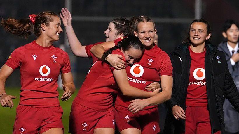 Wales celebrate their 17-0 victory over Japan