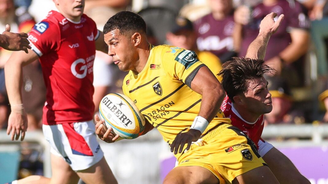 Rio Dyer runs with the ball for Dragons against Scarlets