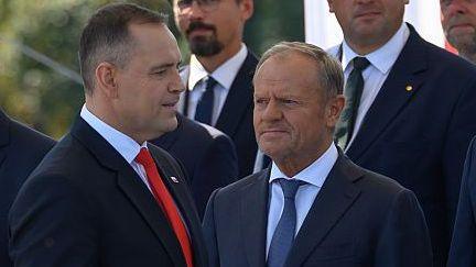 Polish President Karol Nawrocki (left) and Polish Prime Minister Donald Tusk at a military parade in Warsaw. Photo: 15 August 2025.