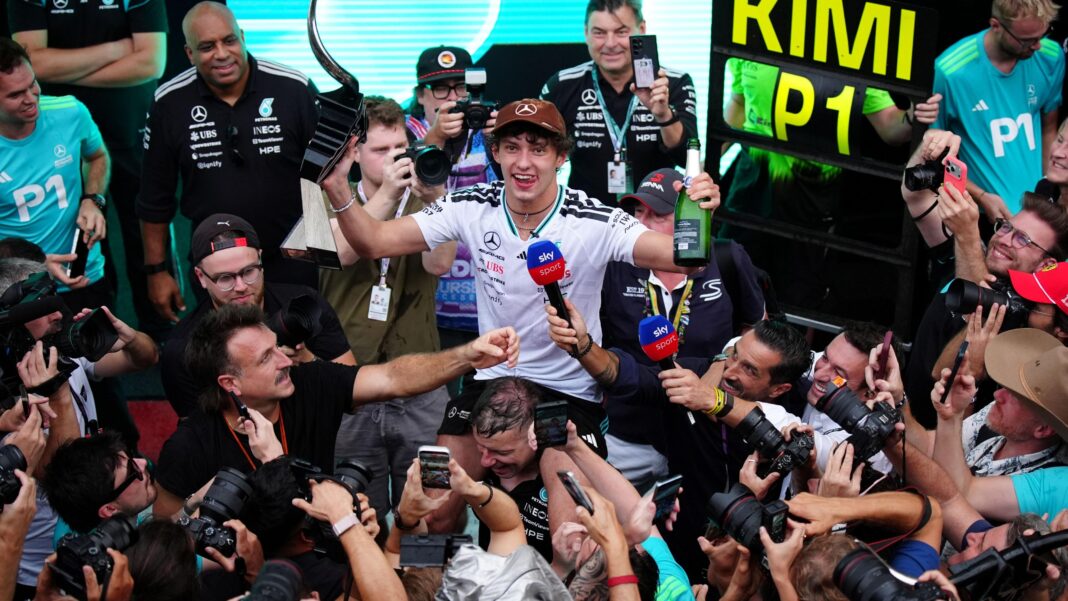 Antonelli delivers ‘the race of a champion who isn’t the champion yet’ Kimi Antonelli celebrating with the Mercedes team after winning the US Grand Prix. He is surrounded by people taking photographs or holding microphones