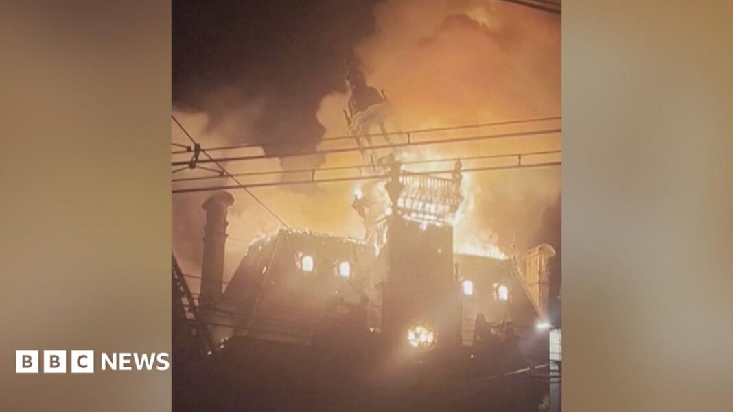 Watch: Moment historic French town hall spire collapses in flames amid protests image