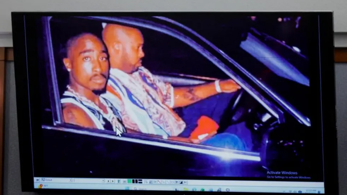 A 1996 photo of rapper Tupac Shakur (L) and Marion "Suge" Knight displayed during the murder trial