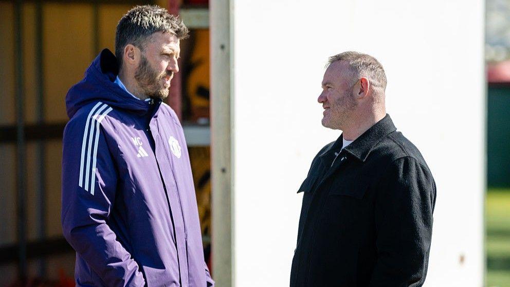 Wayne Rooney with former Manchester United team-mate Michael Carrick at the club's Carrington training ground