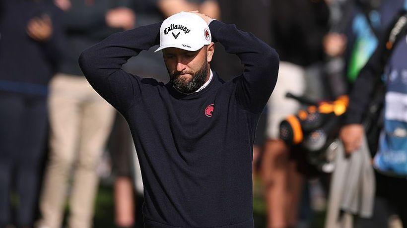 John Rahm put his head in his hands
