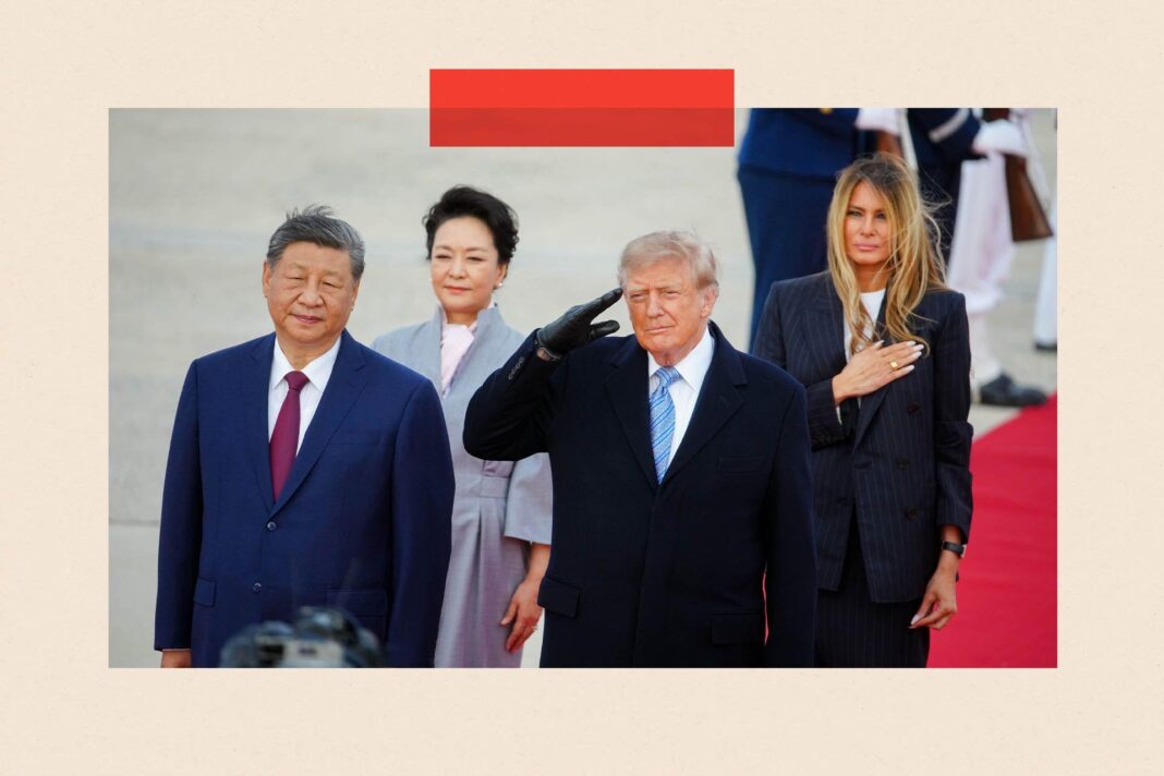 Donald Trump and Xi Jinping stand on a red carpet with their wives behind them. Both are wearing dark suits. Trump is saluting