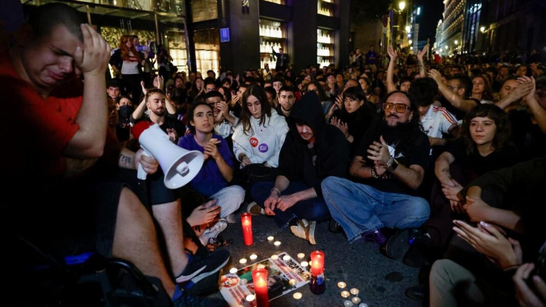 Spanish pensioner whose eviction sparked nationwide protests dies, union says People gather in one of Madrid's main squares, Puerta del Sol, following the death of Maricarmen Abascal. One man can be seen carrying a megaphone as he appears emotional, while others sit crossed legged. Candles have been lit in memory of Maricarmen.