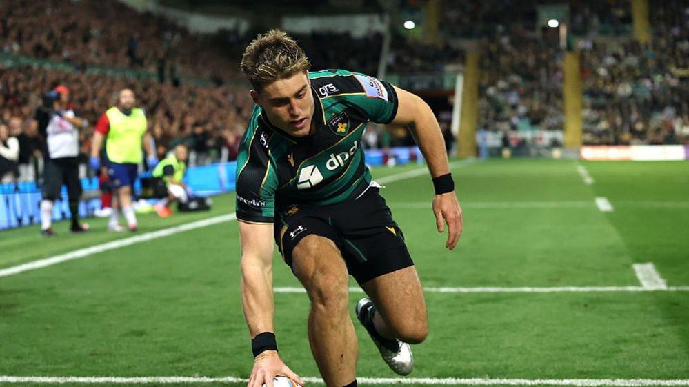 Tommy Freeman about to touch the ball down to score a Northampton try