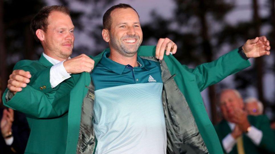 Danny Willett presents Sergio Garcia with the green jacket after Garcia won the 2017 Masters in a play-off