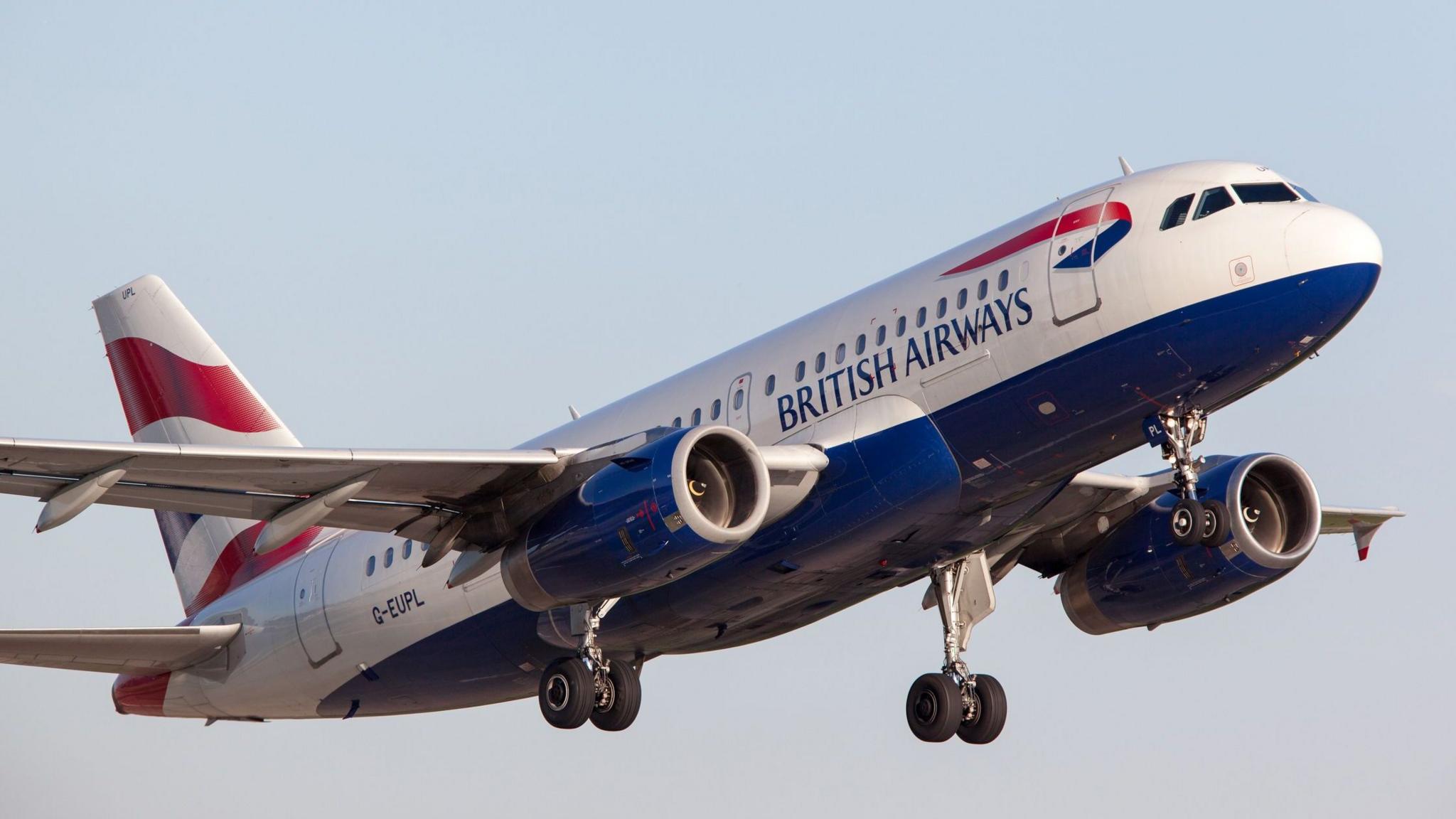 A British Airways plane taking off.