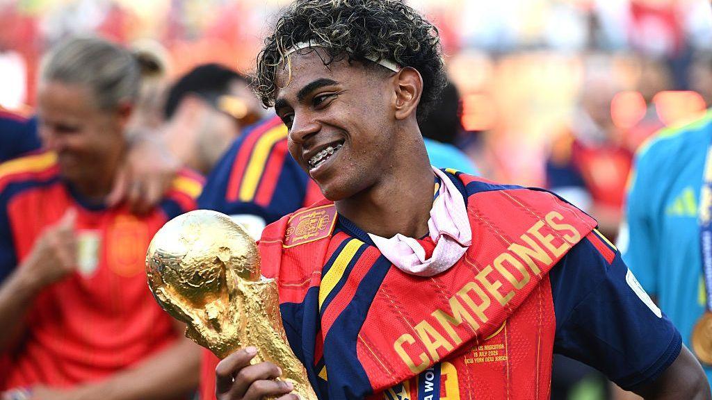 Lamine Yamal with World Cup trophy