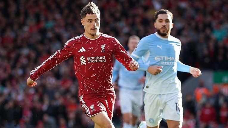 Florian Wirtz and Rayan Cherki in action during Manchester City's 3-0 win against Liverpool at Anfield