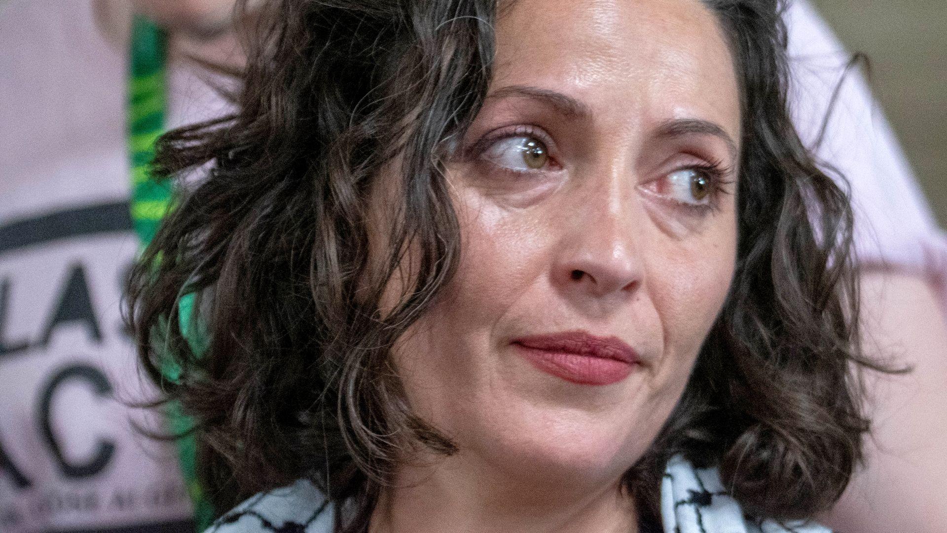 A close up image of Lubna Speitan looking to her side.