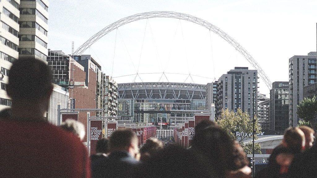 Fans approach Wembley Stadium
