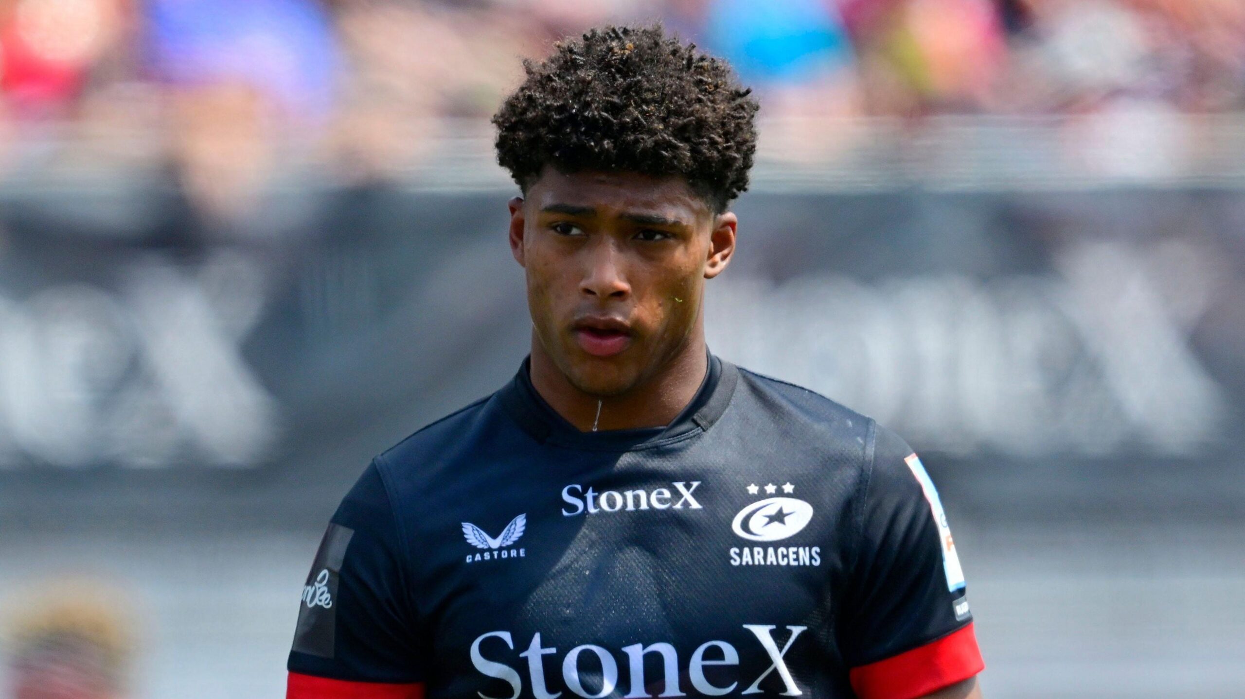 Noah Caluori walking on the pitch wearing Saracens kit last season