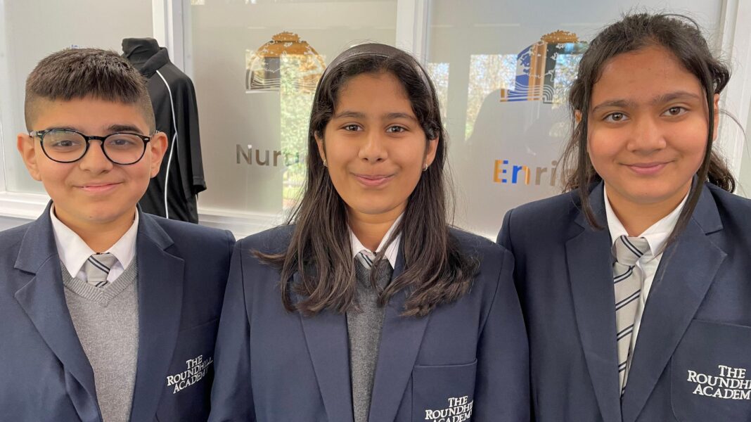 Craig Charles’ tribute to ‘city that shaped me’ Three pupils are wearing Roundhill Academy school uniform.