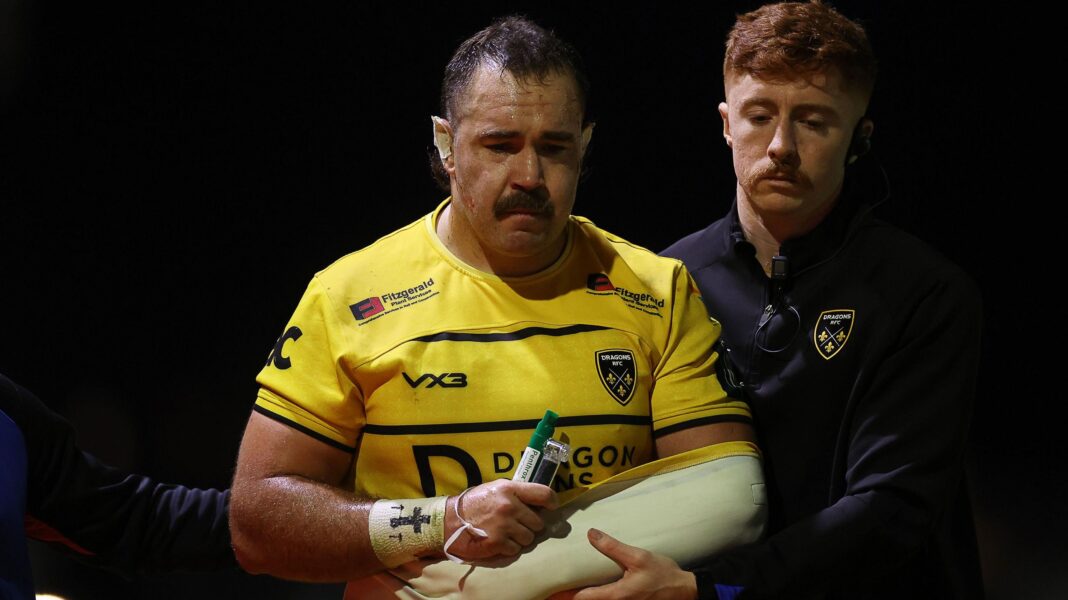 Dragons count on squad depth against Zebre amid Wales calls Robert Hunt is helped from the field with his left arm in a sling