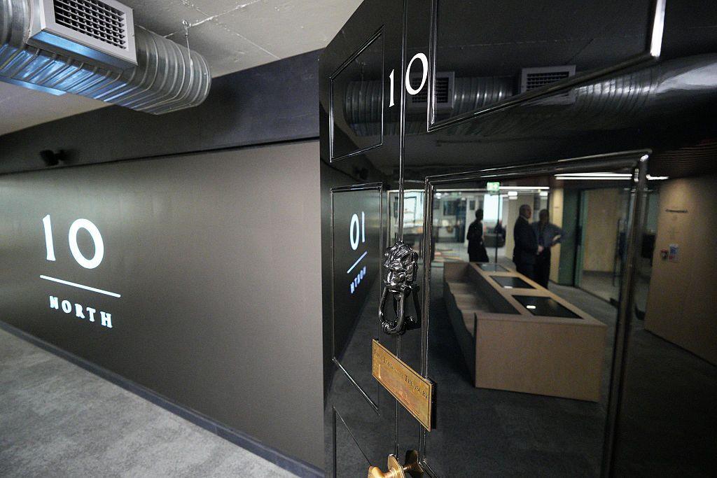 A black shiny No10 North door inside Number 10 North's office.