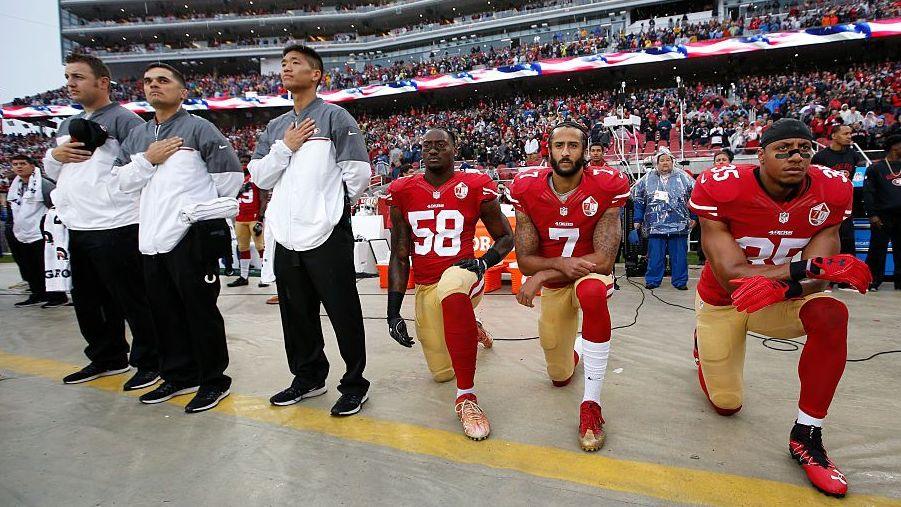 Colin Kaepernick kneels