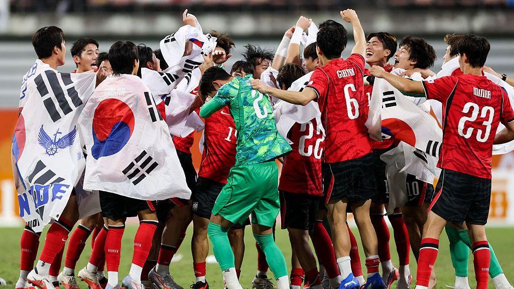 South Korea squad celebrating a victory at the Asian Games