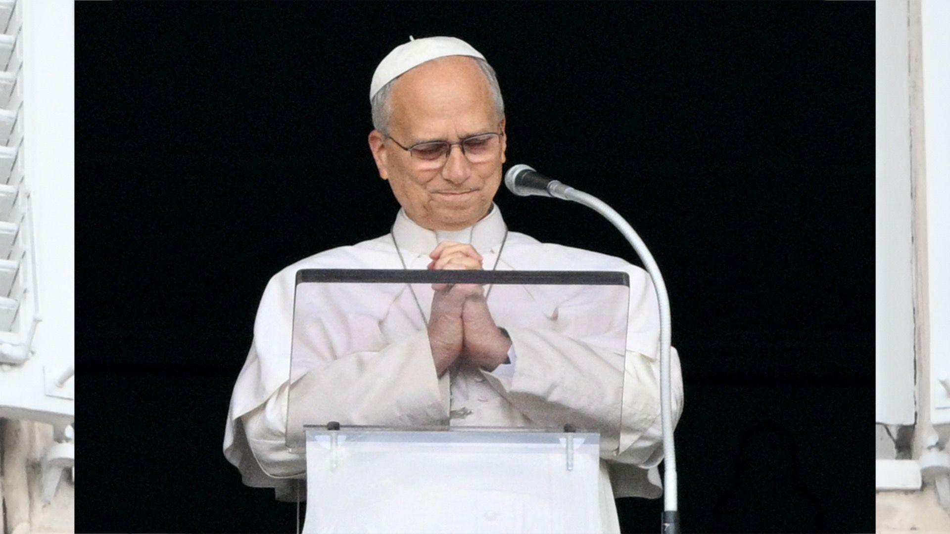 Pope Leo clasps his hands in prayer