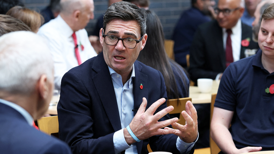 Burnham says he wants to cut welfare bill ‘as soon as we possibly can’ Andy Burnham sitting at an event in Derby with Chancellor John Healey in the background